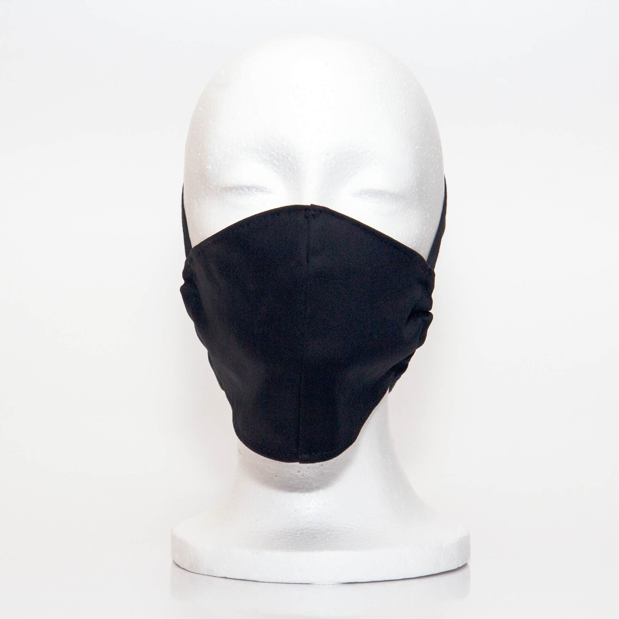 Black Alpha Mask Front View: Solid black colour fabric face mask contoured to fit comfortably on your face. This is a 3 layer fabric mask with a middle pocket to insert the filter as the third layer. The bias binding straps is easily adjustable for your comfort and ties behind your head. This mask has a removable filter. This mask an unisex adult fit.