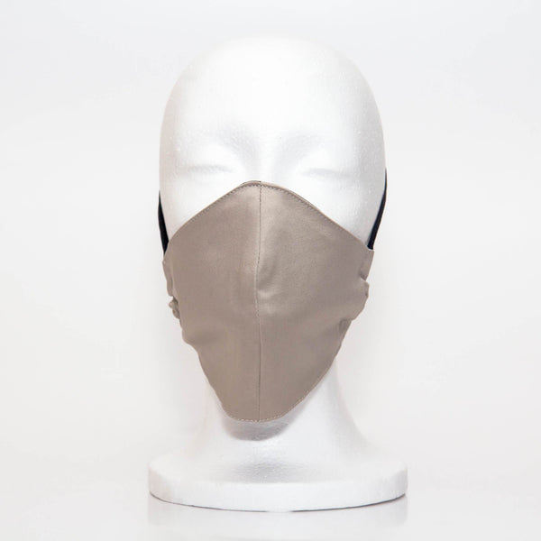 White Sand Alpha Mask Front View: Our white sand colour is a light khaki colour fabric face mask contoured to fit comfortably on your face. This is a 3 layer fabric mask with a middle pocket to insert the filter as the third layer. The bias binding straps is easily adjustable for your comfort and ties behind your head. This mask has a removable filter. This mask an unisex adult fit.