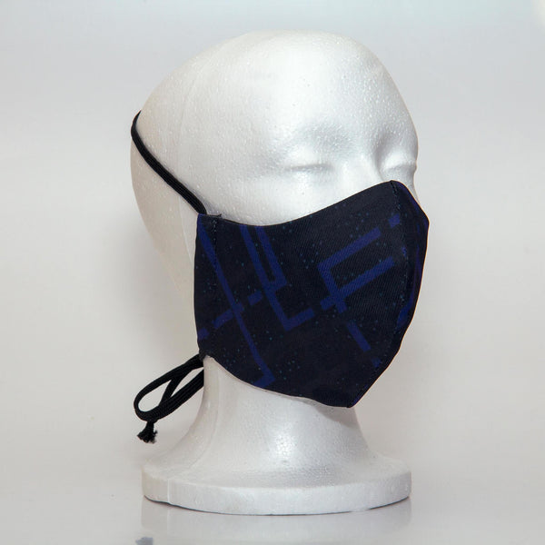 Oltre Print Mask Side View: Black & Blue print. The soft woven strap is easily adjustable around your head for your comfort. 3 Layer fabric mask with a middle filter layer that is contoured to fit comfortably on your face. Mask will fit men.