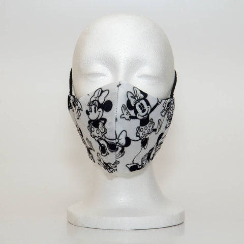 Oltre Print Mask Front View: Minnie Mouse print. Minnie Mouse mask is for your inner Disney lover. 3 Layer fabric mask with a middle filter layer that is contoured to fit comfortably on your face. Mask will fit women and teen girls.