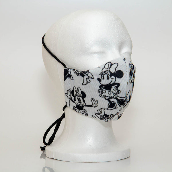 Oltre Print Mask Side View: Minnie Mouset print. The soft woven strap is easily adjustable around your head for your comfort. 3 Layer fabric mask with a middle filter layer that is contoured to fit comfortably on your face. Mask will fit women and teen girls.