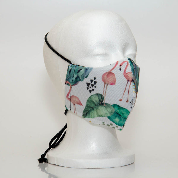 Oltre Print Mask Side View: Flamingos print. The soft woven strap is easily adjustable around your head for your comfort. 3 Layer fabric mask with a middle filter layer that is contoured to fit comfortably on your face. Mask will fit women and teen girls.