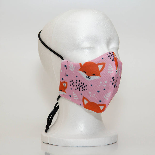 Oltre Print Mask Side View: Pink Foxes print. The soft woven strap is easily adjustable around your head for your comfort. 3 Layer fabric mask with a middle filter layer that is contoured to fit comfortably on your face. Mask will fit women and teen girls.