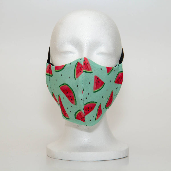 Oltre Print Mask Front View: Watermelon print. Our juicy, fruity watermelon print is bright and playful and a bold, cheerful addition to your outfit. 3 Layer fabric mask with a middle filter layer that is contoured to fit comfortably on your face. Mask will fit women and teen girls.