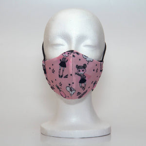 Oltre Print Mask Front View: Pink Supergirl print. Feel like a supergirl standing up for what is right in our stunning Supergirl print. 3 Layer fabric mask with a middle filter layer that is contoured to fit comfortably on your face. Mask will fit pre-teen girls between 7 to 12 years old.