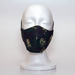 Oltre Print Mask Front View: Army print. Our army print with the skull camoflage design is for the hunter in you. 3 Layer fabric mask with a middle filter layer that is contoured to fit comfortably on your face. Mask will fit teen boy from 12 years and older.