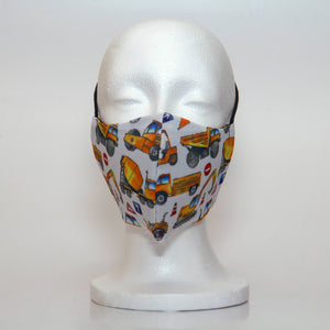 Oltre Print Mask Front View: Yellow Construction print. Grab your hard hat and get ready to start your imagination to build with our yellow construction print. 3 Layer fabric mask with a middle filter layer that is contoured to fit comfortably on your face. Mask will fit teen boy from 12 years and older.