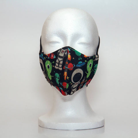 Oltre Print Mask Front View: Multicolour space print. Housten we have lift off in our outerspace print for the little astronaut dreamer. 3 Layer fabric mask with a middle filter layer that is contoured to fit comfortably on your face. Mask will fit pre-teen boys between 7 to 12 years old.